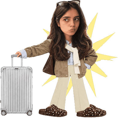 Ananya walking with a suitcase